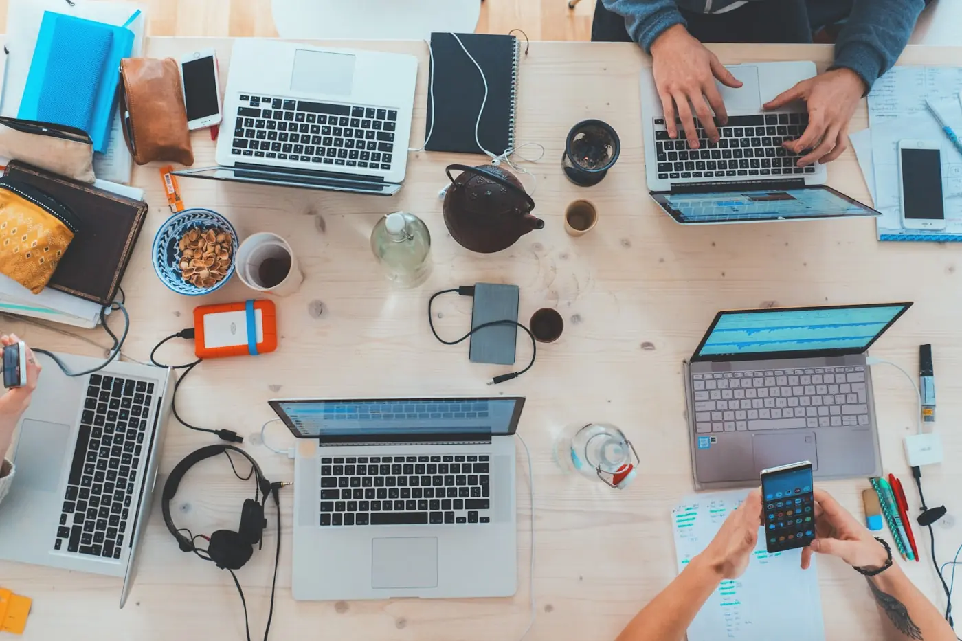 A startup team building a product together across laptops